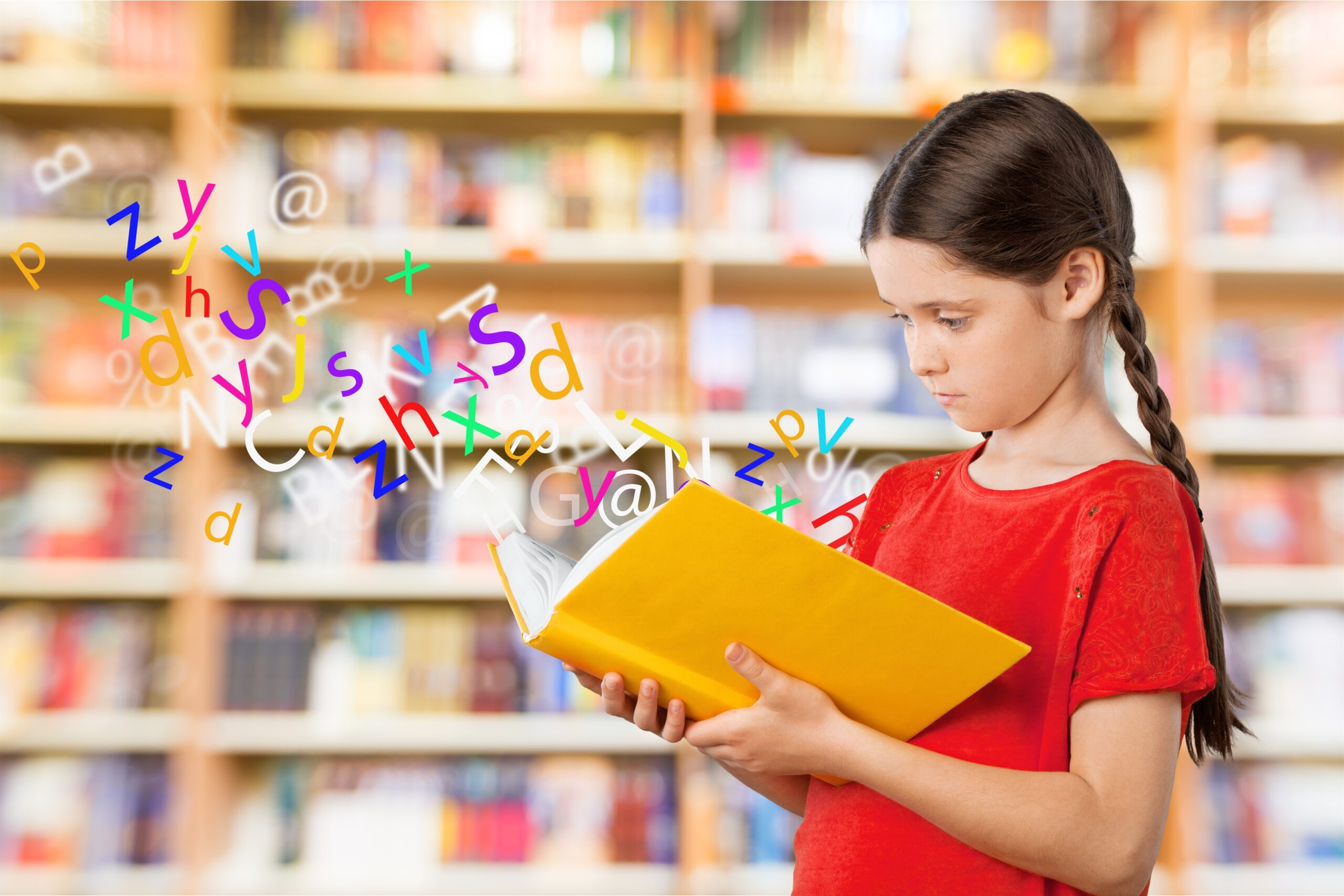 Young cute girl reading book