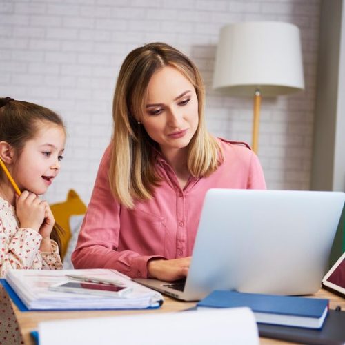 mother-working-with-little-daughter-home-interior_329181-19002